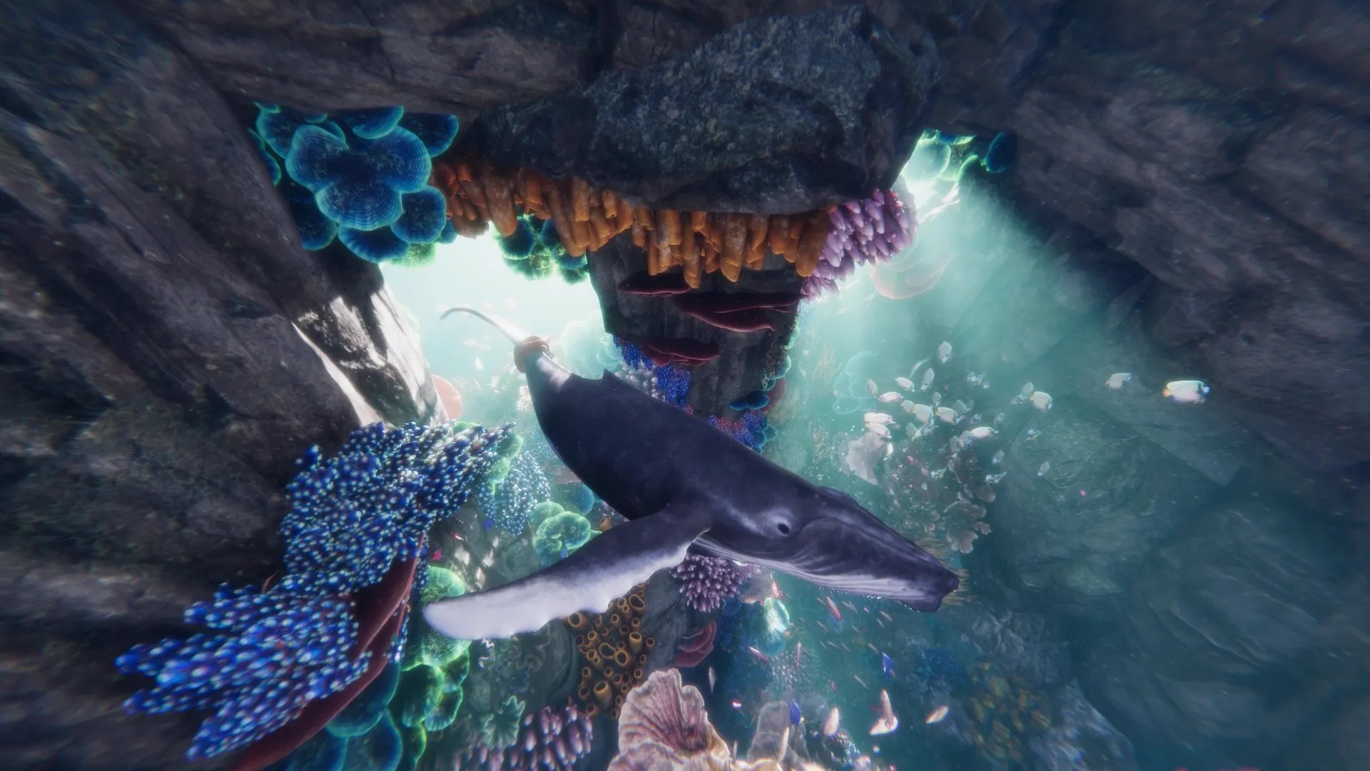 Ocean II: a humpback whale gliding through a coral arch